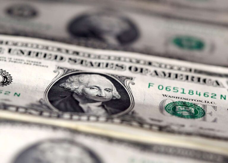 Dollar flirts with three-week low as investors count on eventual stimulus