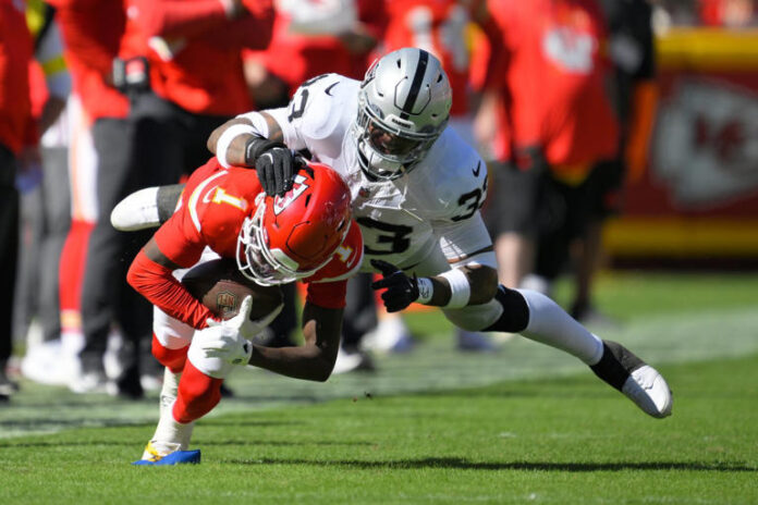 Kansas City Chiefs wide receiver Xavier Worthy (1) recovers a fumble by teammate Hollywood Brown Las Vegas Raiders linebacker Jamal Adams (33) during the second half of an NFL football game Sunday, Oct. 19, 2025, in Kansas City, Mo. (AP Photo/Reed Hoffmann) © The Associated Press