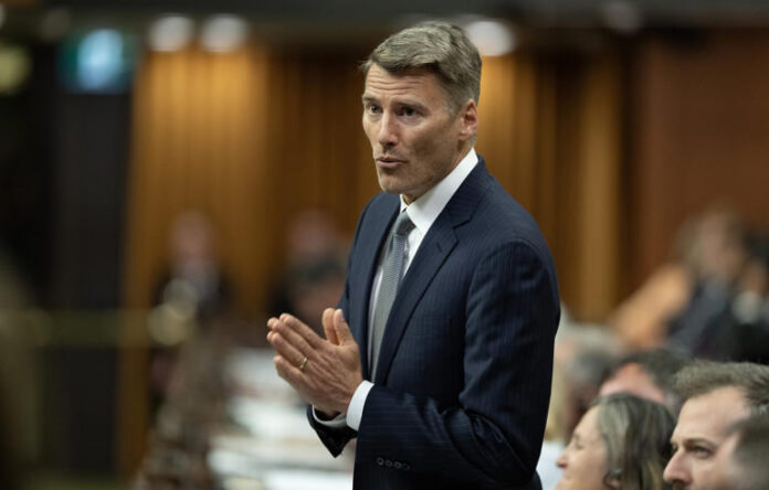 Minister of Housing and Infrastructure Gregor Robertson rises during question period on Parliament Hill in Ottawa on Monday, Sept. 15, 2025. THE CANADIAN PRESS/Adrian Wyld © The Canadian Press