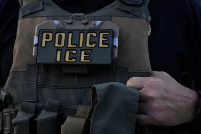 FILE - A U.S. Immigration and Customs Enforcement agent takes part in an early morning operation in Park Ridge, Ill., Sept. 19, 2025. (AP Photo/Erin Hooley, File) © The Associated Press
